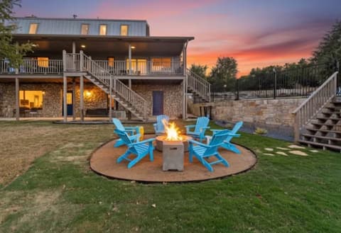 Elite STR Hosting Co Hill Country stone ranch home with covered patio